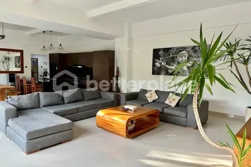 Impressive Six-Bedroom Residence in Seminyak Blending Enclosed Comfort with Open Tropical Elegance