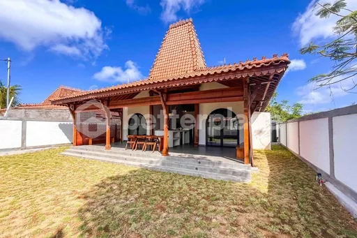 Yearly Rental 2-Bed Villa Offering Timeless Wooden Joglo Architecture, Open Living Concept, and Serene Tropical Ambience in South Bali