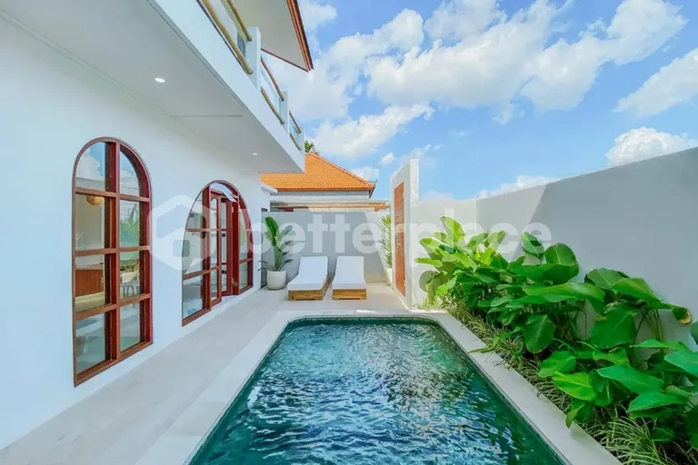 Refined Yearly Rental Opportunity: Furnished 2BR Villa with Pool and Enclosed Living in Tranquil Canggu Setting