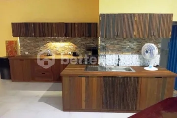 Experience Authentic Balinese Living in a Hand-Carved Wooden 1-Bed Apartment with Large Terrace in Saba